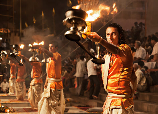 Ganga Aarti ritual VARANASI, INDIA - APRIL 11: An unidentified Hindu priest performs religious Ganga Aarti ritual (fire puja) at Dashashwamedh Ghat on April 11, 2012 in Varanasi, Uttar Pradesh, India